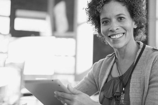 Cybersecurity aware woman on a tablet