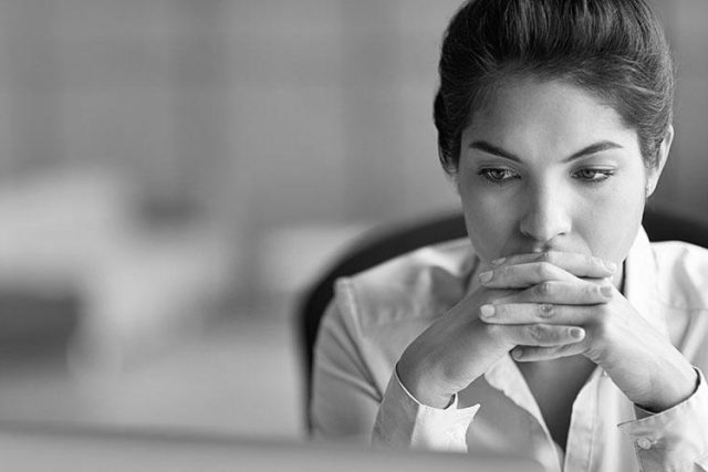 business woman looking at a laptop.